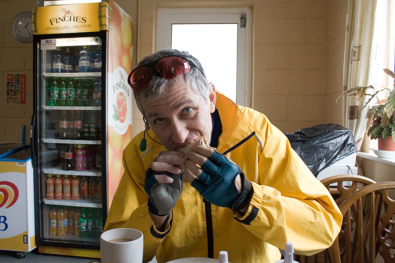 Back on the mainland, Mark enjoys a fresh sausage sandwich in the cafe at the ferry terminal.