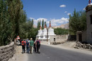 Group walking along the road leaving Thiksey