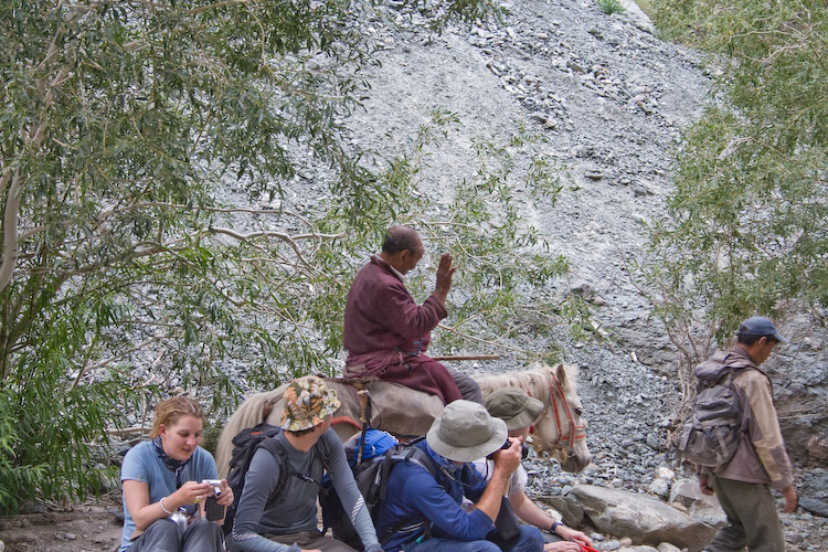 A monk passes by - note Alex's hat (the flowery one).